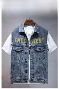 Detail of yellow ENDO WENT patch embroidery on vintage wash denim vest for men