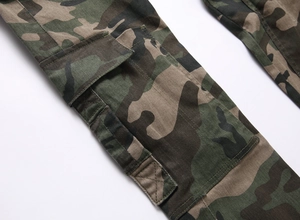 Close-up of large side cargo pocket on camouflage work pants with durable stitching