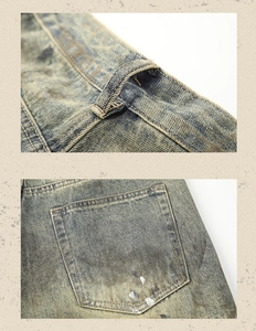 Detailed view of vintage washed denim jeans with distressed yellow mud effect and paint splatters