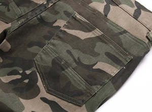 Detailed close-up of heavy cotton camouflage fabric and reinforced stitching on cargo pants