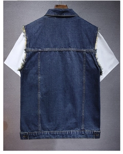 Detail view of denim vest back featuring distressed frayed edges and adjustable hem buttons