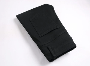 Detail view of black stretch denim jeans featuring reinforced back pockets and twin-needle stitching