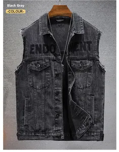 Detail of grey denim vest showing ENDOWMENT embroidery and vintage wash texture