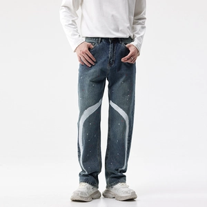 Jean ample pour homme avec peinture blanche courbée et taches d'encre rouge tendance