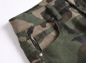 Detail of camouflage cargo pants showing twill fabric texture and metal rivet button