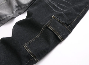 Detailed close-up of side cargo pocket with contrast yellow stitching on black denim
