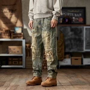 Men's vintage distressed loose jeans with retro wash patches and streetwear style