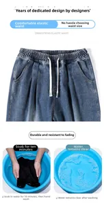 Detail of men's dark blue jeans with elastic waist and white drawstring design