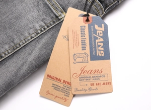 Close-up of denim fabric texture with classic navy and yellow tags for men's jeans