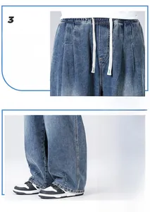 Detail of light blue straight-leg jeans featuring an elastic drawstring waist and hem