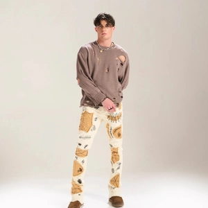 Street style punk distressed knit sweater and patched flare jeans outfit set