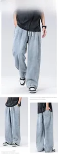 Dettaglio dei jeans uomo a gamba larga lavaggio azzurro con coulisse e vestibilità comoda