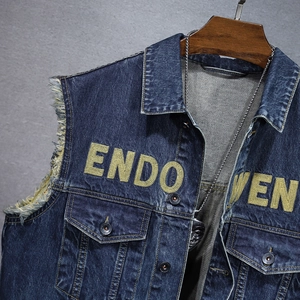 Street style dark blue denim vest with frayed armholes and yellow ENDOVEN embroidery
