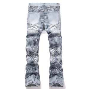 Men's slim fit light blue flared denim jeans with all-over black street art graffiti print