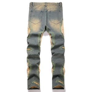 Men's vintage distressed straight-leg denim jeans with green zigzag embroidery details