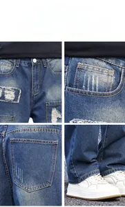 Detail view of vintage ripped jeans showing heavy distress, metal buttons and patch pockets