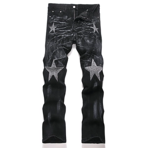 Slim fit black distressed denim jeans for men with star patchwork and washed finish