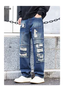 Detail of distressed patchwork and ripped elements on vintage street style men's jeans