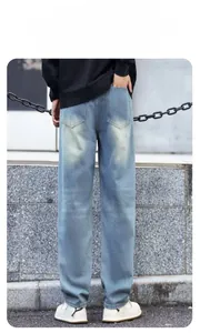 Rear view of light blue distressed denim jeans with vintage washed texture and back pockets