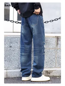 Back view of men's vintage distressed jeans with heavy destroyed details and patches