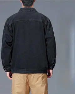 Detail view of the washed black denim jacket back featuring vintage texture and seams