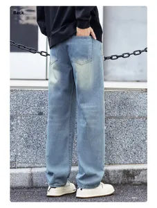 Rear view of light blue washed denim jeans featuring classic back pockets and stitching