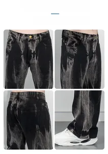 Vues détaillées du jean noir délavé montrant la texture usée et la coupe droite ample