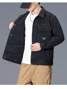 Detail of black workwear denim jacket with Fashion Jeans printed flap pocket
