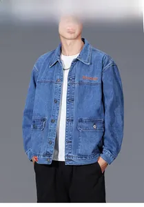 Blue denim jacket with front cargo pockets and orange embroidery on the chest