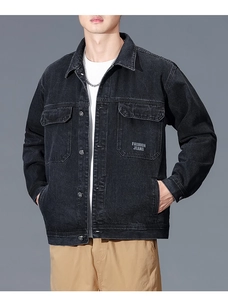 Detailed view of black denim work jacket with chest pockets and Fashion Jeans print