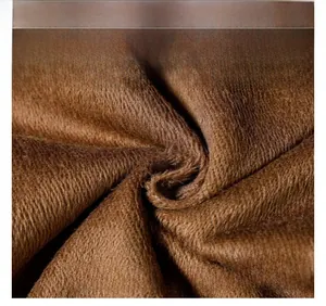 Detail of warm brown fleece lining texture with soft thermal fabric for winter pants