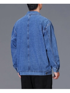 Rear view of casual blue denim jacket featuring central back seam and hem adjustment buttons