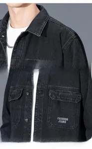 Detail of black denim jacket featuring fashion embroidery and durable metal buttons