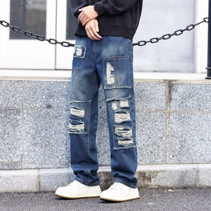Men's retro distressed wide-leg jeans with heavy washing and patchwork detail