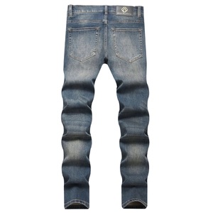 Men's slim fit stretch denim jeans in nostalgic blue with double back pockets and leather tag