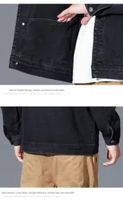 Detail of inner hidden pocket and smooth hemline on black denim workwear jacket