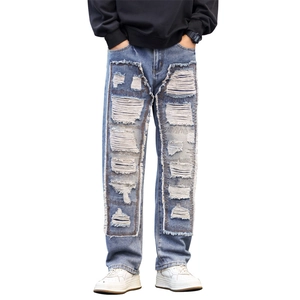 Men's wide-leg distressed blue jeans with heavy-duty layered patchwork and street style rips