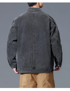 Rear view of washed charcoal denim jacket for men featuring vertical back seam details