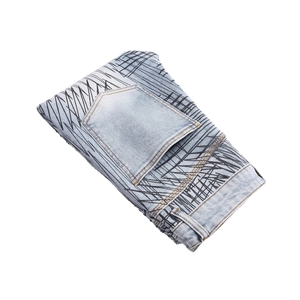 Slim fit light blue flare jeans for men with abstract black graffiti print and pocket detail