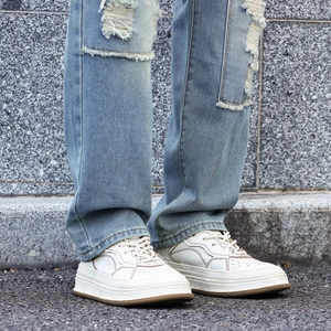 Men's retro distressed straight jeans with heavy destruction and patched hole details