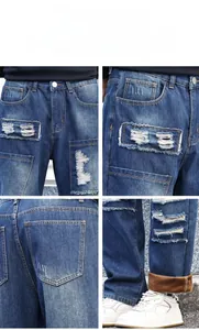 Detail view of baggy distressed jeans showing warm brown fleece lining and patch designs