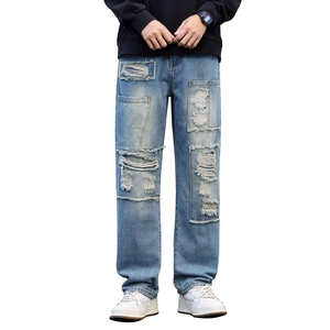 Men's light blue distressed straight-leg jeans with vintage patchwork and ripped details