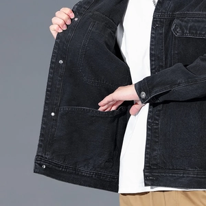Men's washed black denim utility jacket with functional large inner pockets and metal buttons