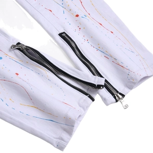 White slim-fit stretch denim jeans for men with artistic paint splatters and hem zippers