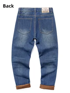 Detail of blue winter jeans featuring warm brown fleece lining and leather brand patch