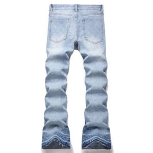 Men's high street stacked jeans in light acid wash with patchwork raw hem and back pockets