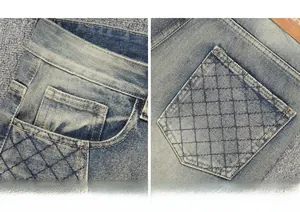 Détail de jean bleu délavé vintage avec coutures en losanges et empiècement en cuir