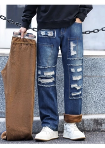 Close-up showing the warm brown fleece lining and distressed denim details of winter pants