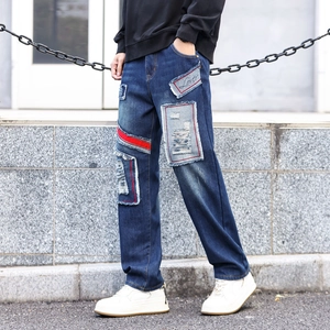 Men's wide leg distressed jeans with blue patches and red side stripe decoration