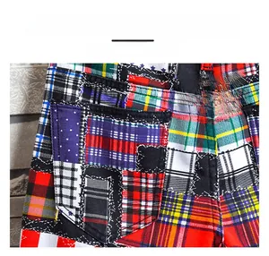 Detail view of plaid patchwork denim shorts featuring reinforced stitching and high-density fabric